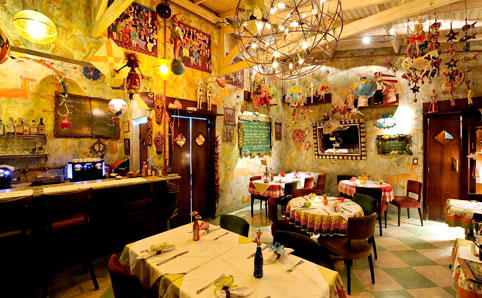 Arts and crafts hang from the ceiling at Mercearia do Conde