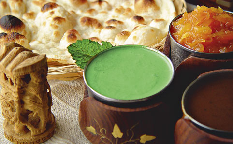 Naan bread with mint, tamarind and papaya chutney