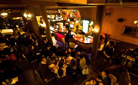 Patrons inside Tubaína bar