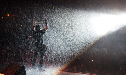 Foo Fighters on stage in the rain